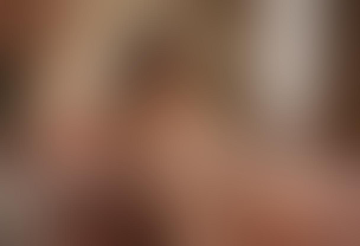 A sultry, intimate boudoir scene capturing the essence of sensuality through a play of soft shadows and warm, inviting light. Featuring a diverse model in elegant lingerie, surrounded by luxurious fabrics and delicate flowers, evoking a mood of allure and confidence. Include artistic elements like strategically placed mirrors and seductive poses that celebrate body positivity. The overall ambiance should be romantic and tasteful, inviting viewers into a world of playful intimacy. super-realistic. warm tones. soft focus.